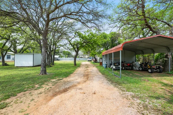 a view of outdoor space with garden and trees