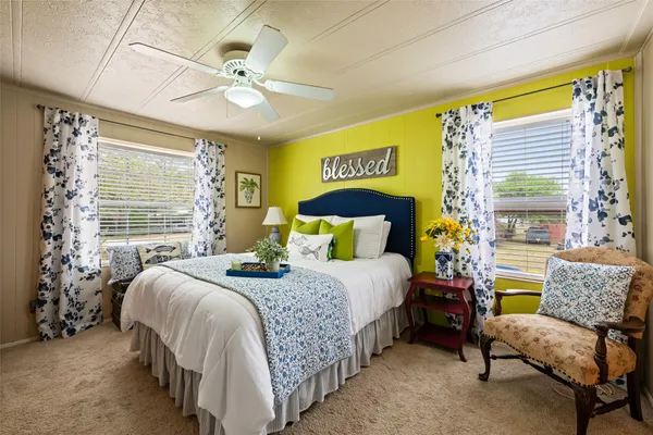 a bedroom with a bed and a couch