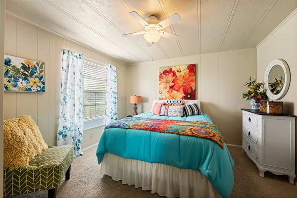 a bedroom with a bed and furniture