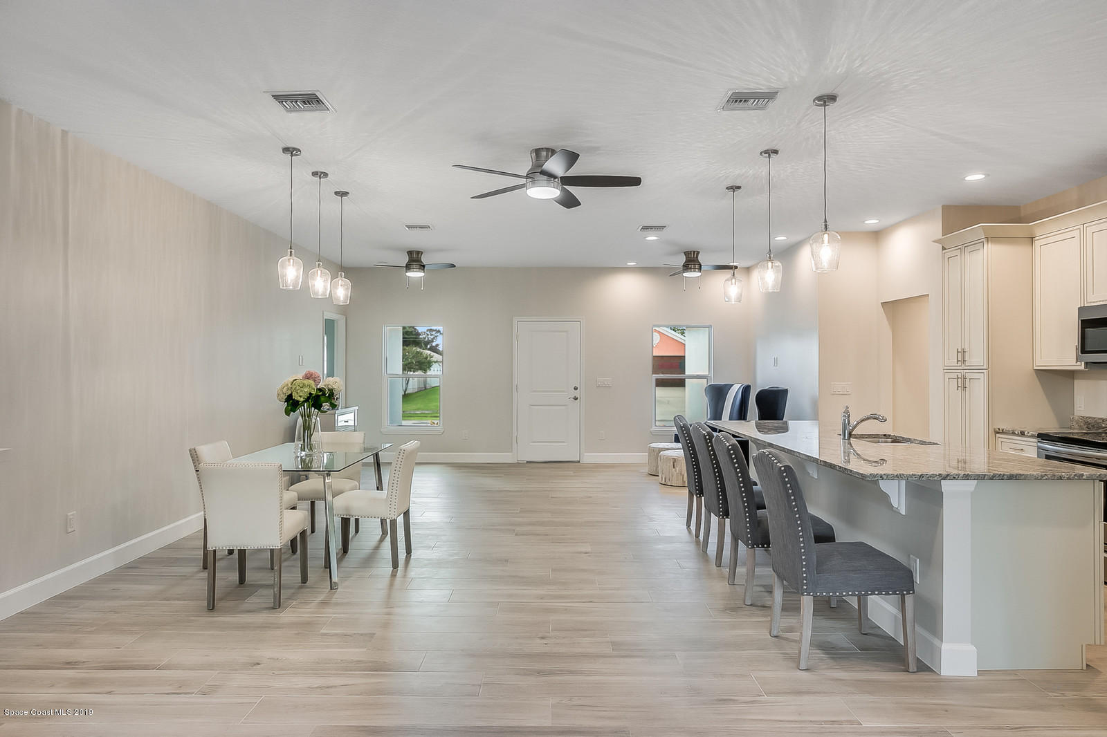 1485 Reed Street Northwest Palm Bay, FL 32907 - Photo 11 of 26 Open Floor Plan Kitchen and Dining