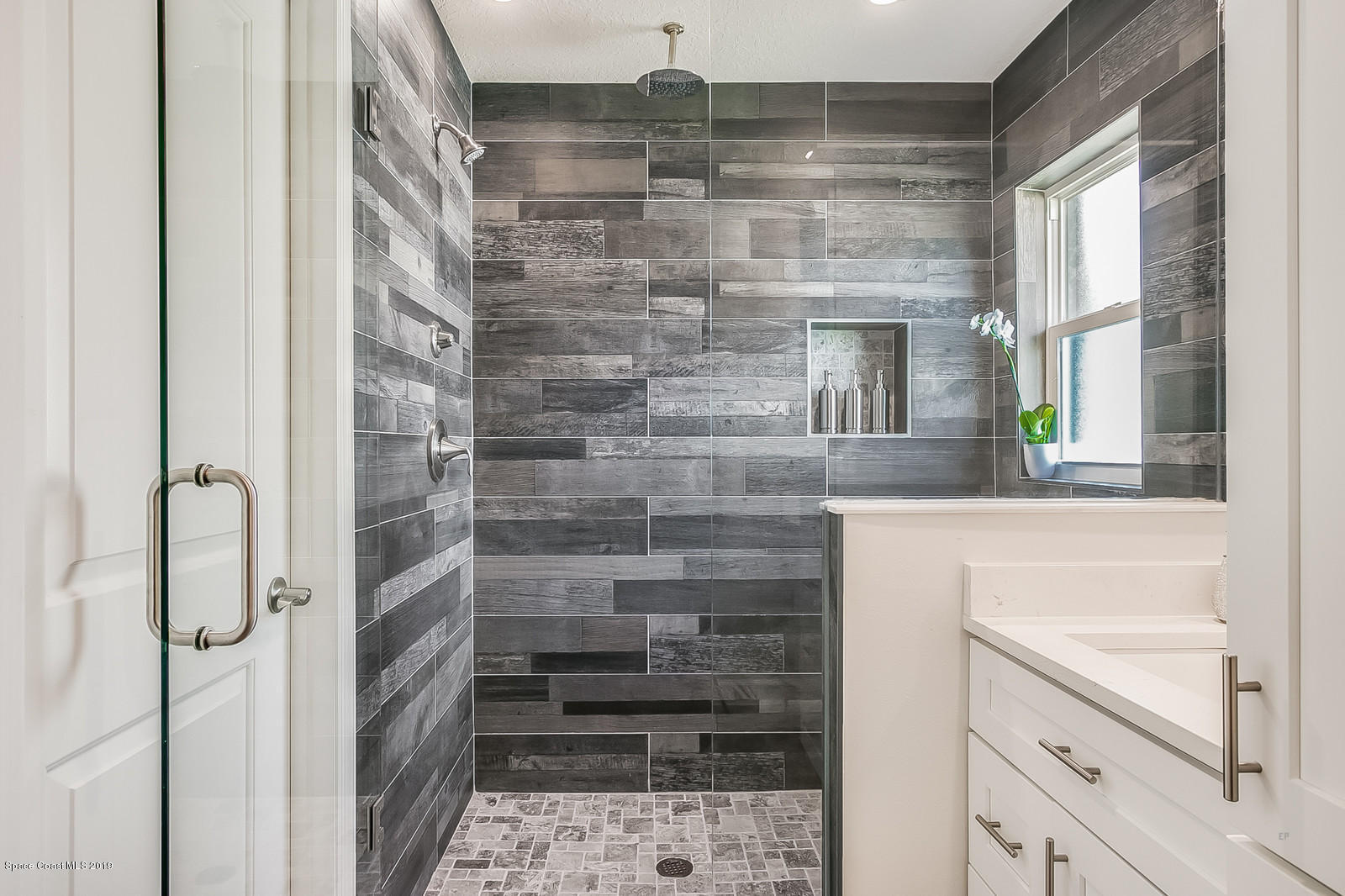 1485 Reed Street Northwest Palm Bay, FL 32907 - Photo 23 of 26 Spacious Shower with bench