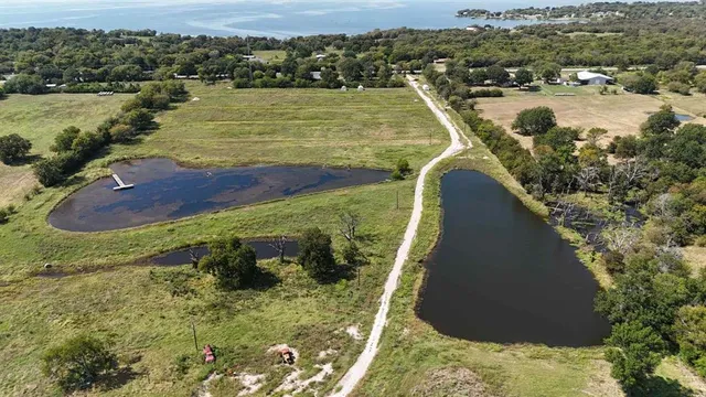 a view of a lake with a yard