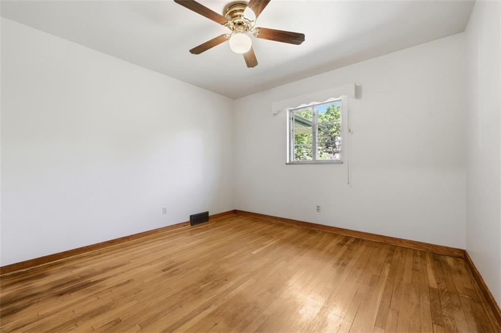 524 McElheny Road Glenshaw, PA 15116 - Photo 19 of 41 wooden floor in an empty room with a window
