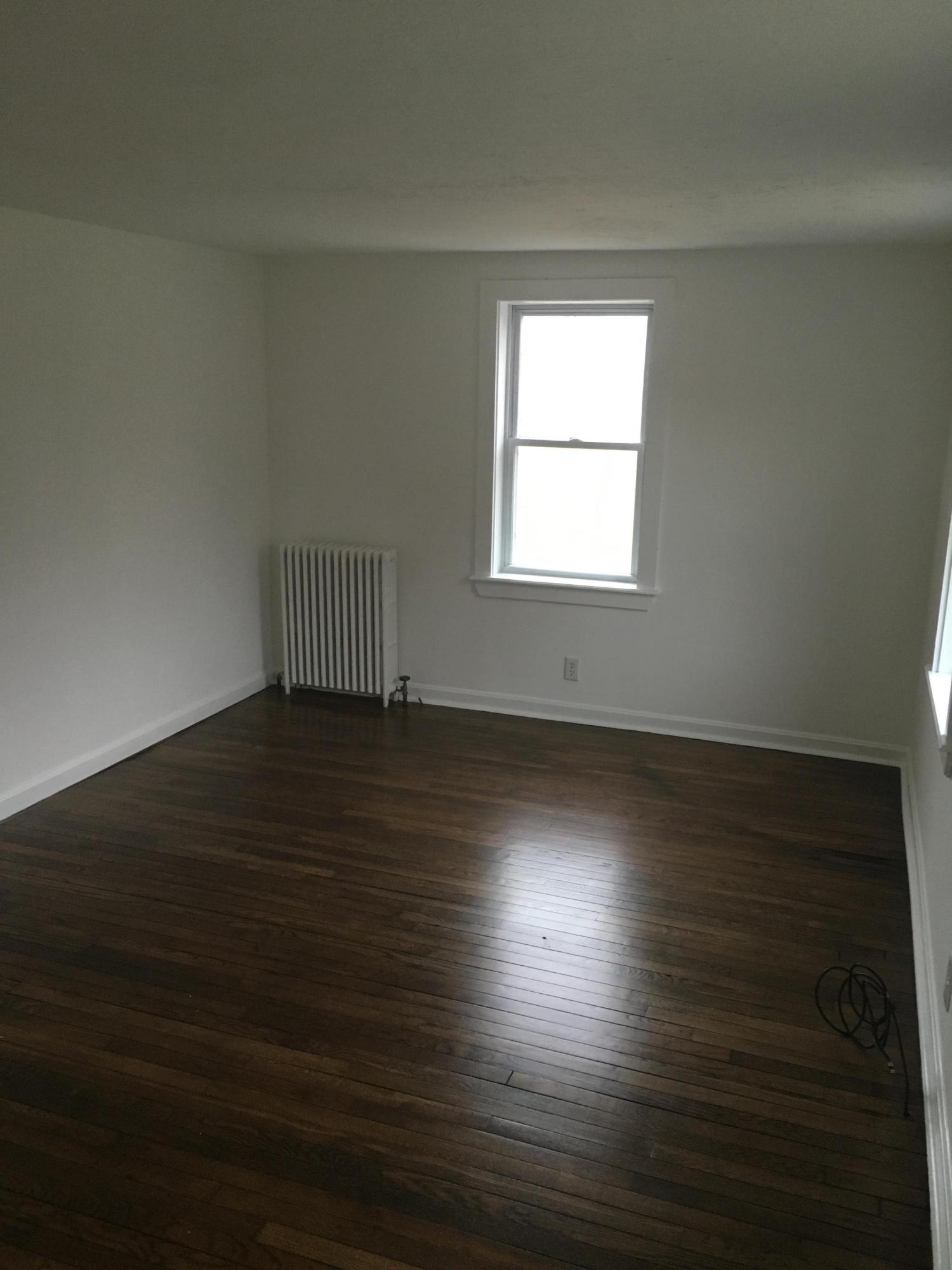 116 Iyannough Road Hyannis, MA 02601 - Photo 5 of 7 an empty room with wooden floor and windows