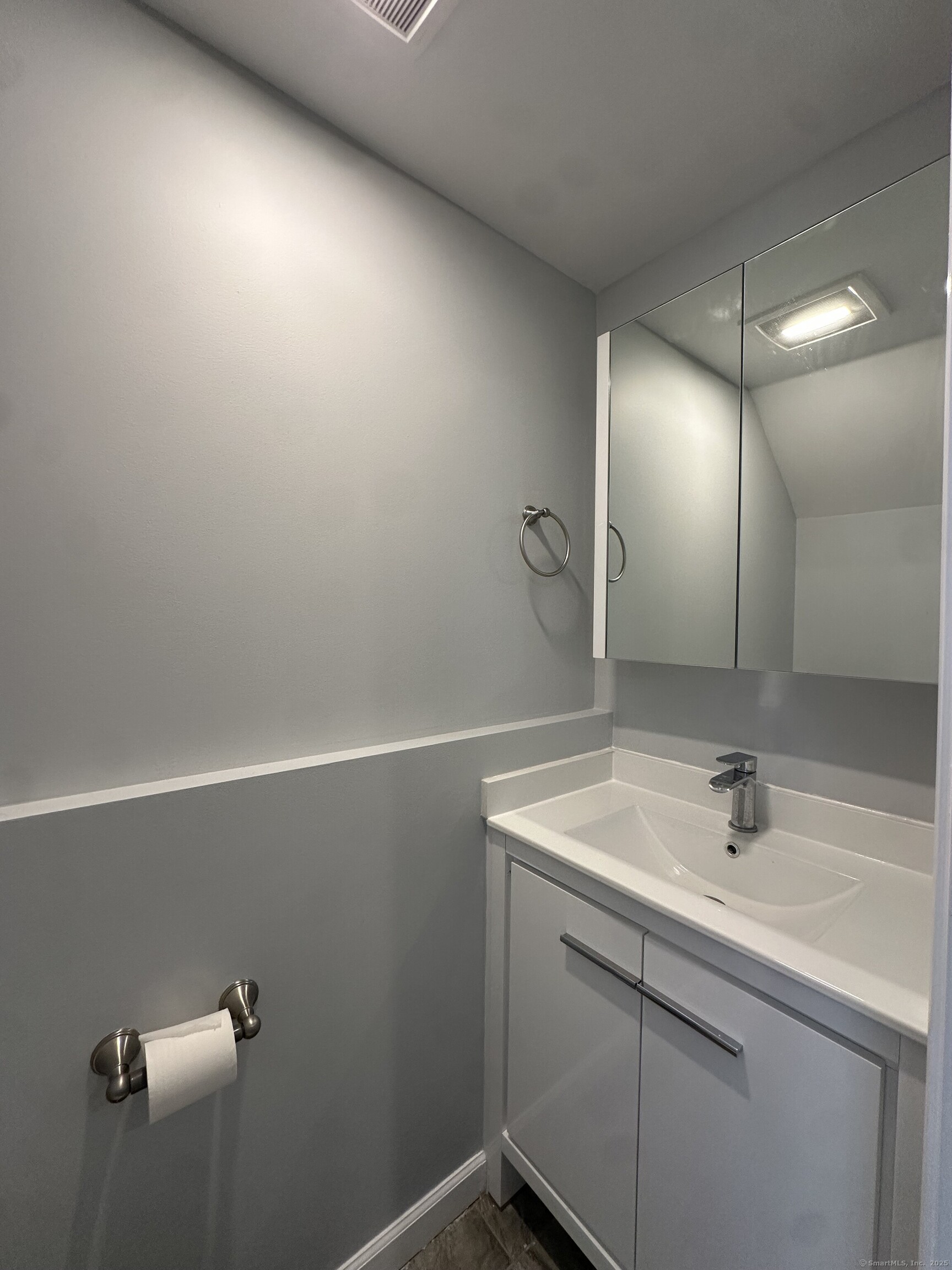 13 Deer Run, Unit 13 Bethel, CT 06801 - Photo 11 of 22 a bathroom with a sink a vanity and a mirror