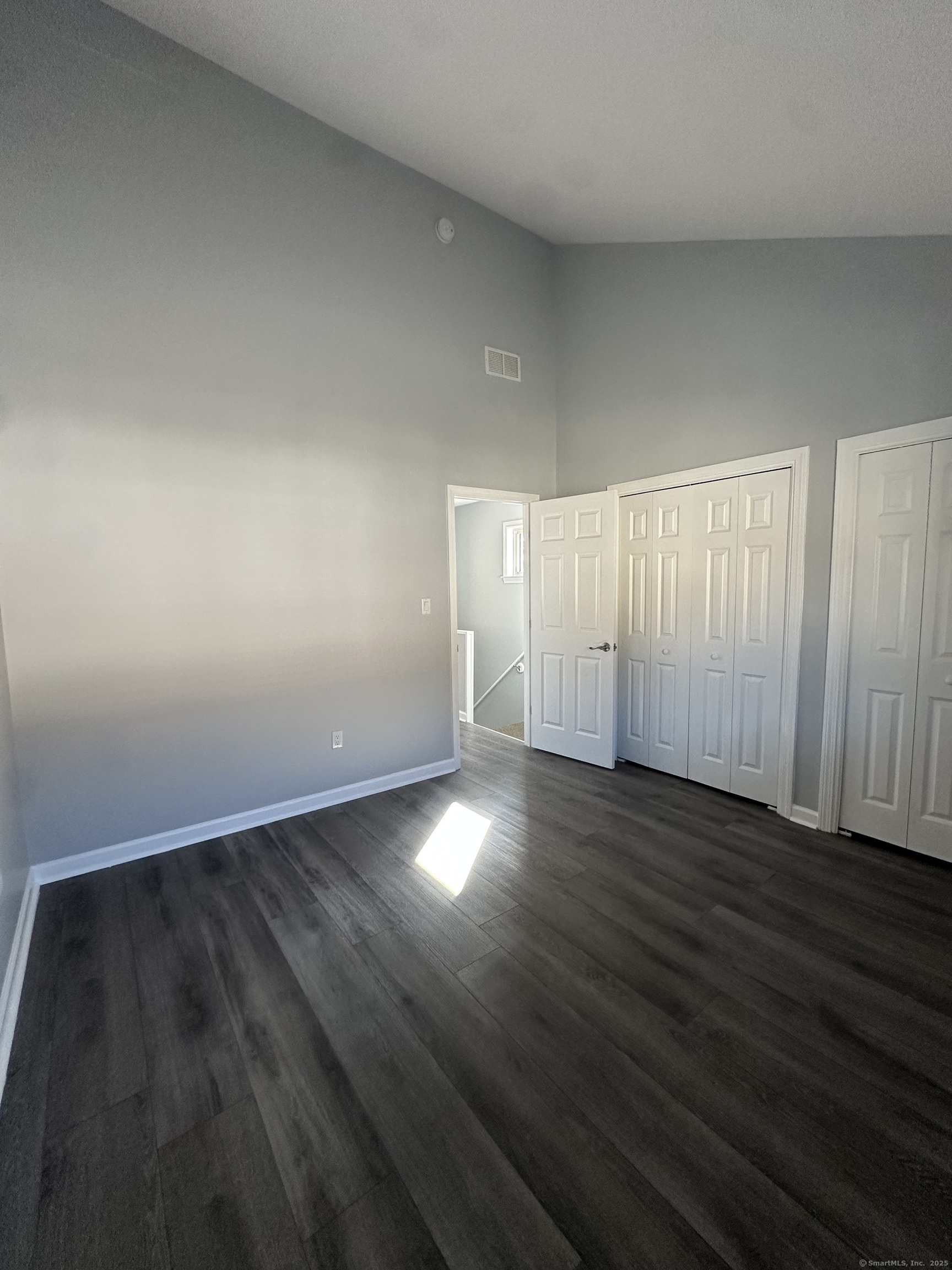 13 Deer Run, Unit 13 Bethel, CT 06801 - Photo 18 of 22 wooden floor in an empty room
