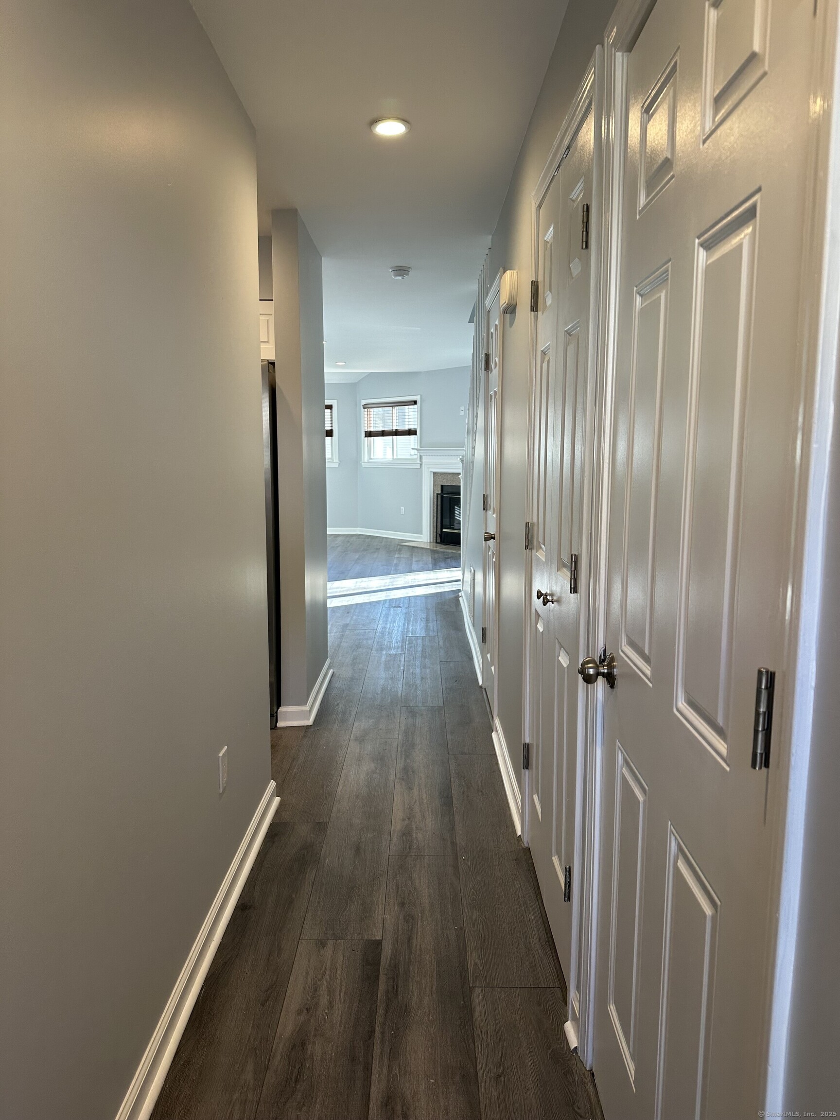 13 Deer Run, Unit 13 Bethel, CT 06801 - Photo 2 of 22 a view of a hallway with wooden floor