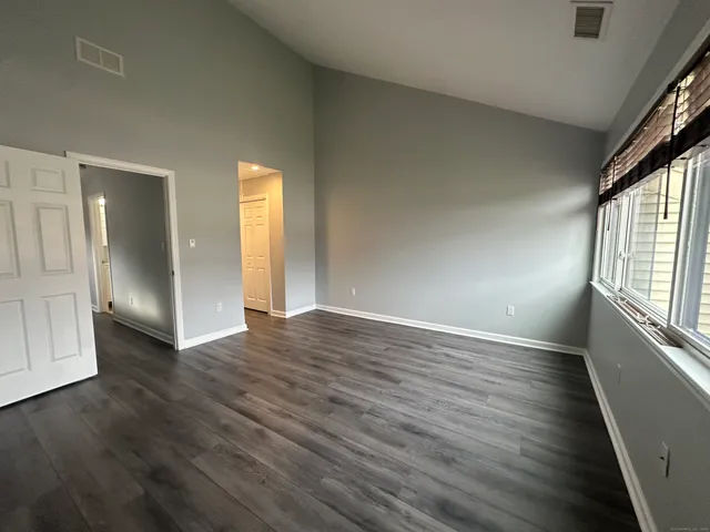 a view of a room with stairs and a window