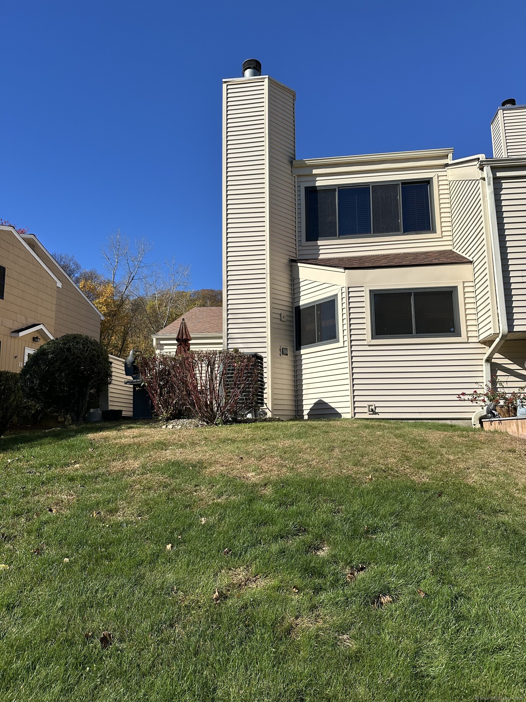 13 Deer Run, Unit 13 Bethel, CT 06801 - Photo 6 of 22 a front view of a house with a yard
