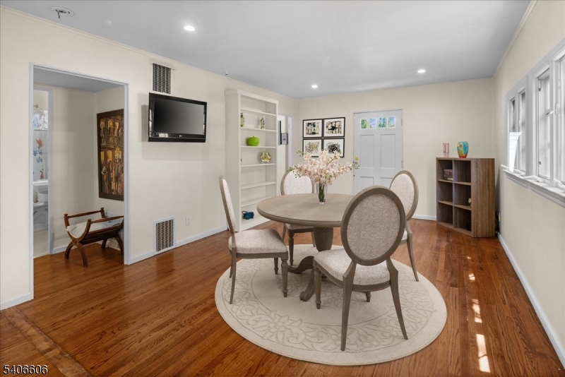 1330 Great Road Skillman, NJ 08558 - Photo 12 of 44 a living room with furniture a flat screen tv and kitchen view