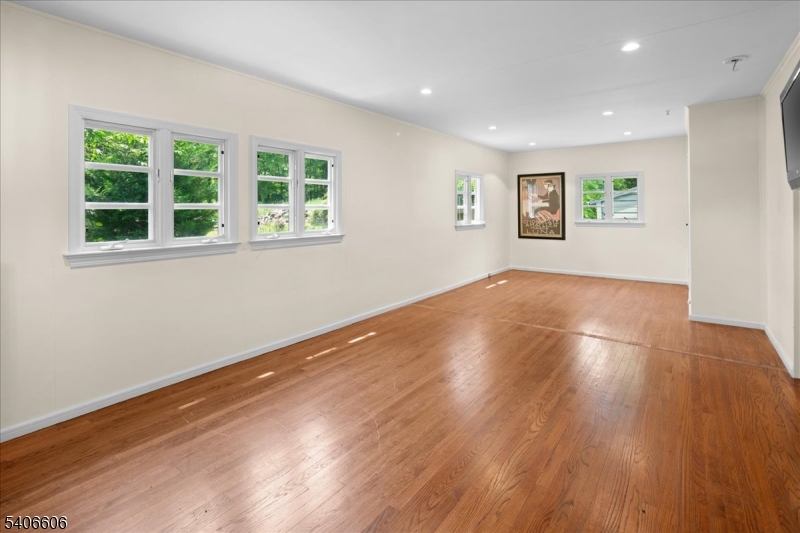 1330 Great Road Skillman, NJ 08558 - Photo 21 of 44 a view of empty room with wooden floor and fan