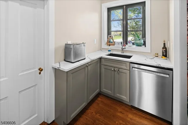 a kitchen with a sink and cabinets