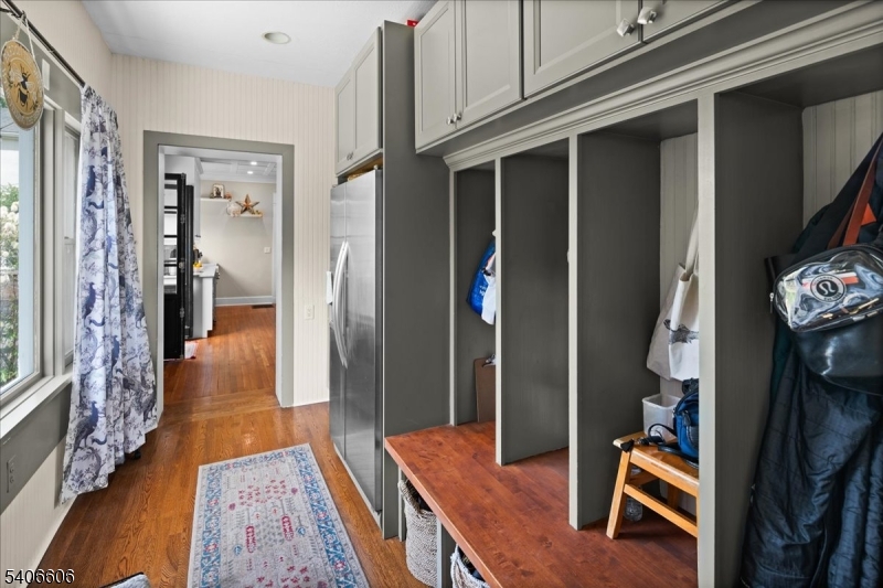 1330 Great Road Skillman, NJ 08558 - Photo 27 of 44 a hallway with furniture and wooden floor