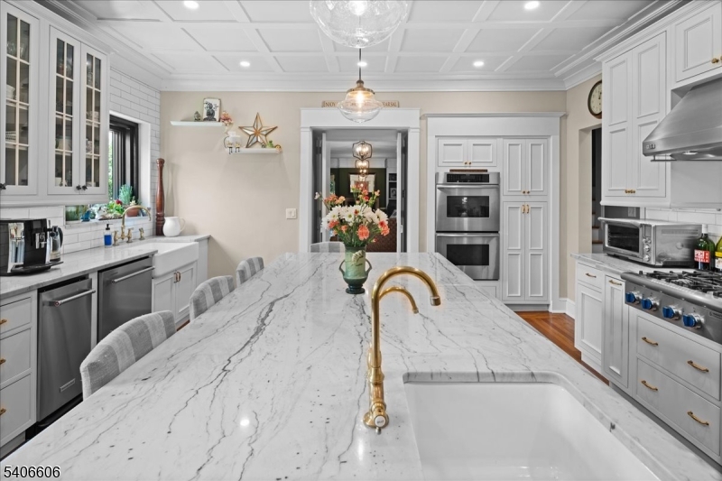 1330 Great Road Skillman, NJ 08558 - Photo 33 of 44 a kitchen with stainless steel appliances kitchen island granite countertop a stove a sink a refrigerator and a refrigerator