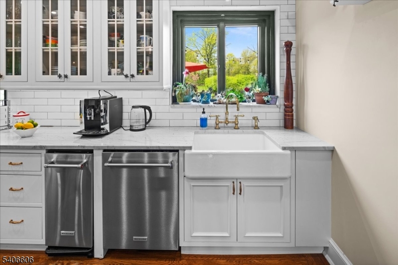 1330 Great Road Skillman, NJ 08558 - Photo 40 of 44 a kitchen with stainless steel appliances granite countertop a sink and a wooden cabinets