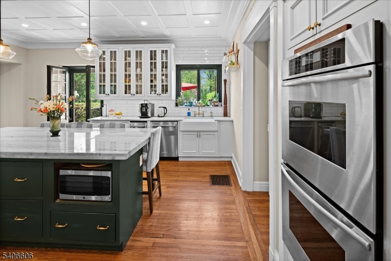 1330 Great Road Skillman, NJ 08558 - Photo 42 of 44 a kitchen with stainless steel appliances granite countertop a stove and a refrigerator