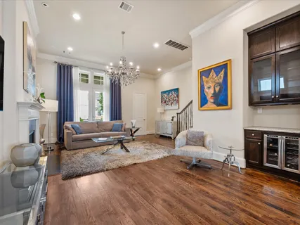 a view of a dining room with furniture and a chandelier