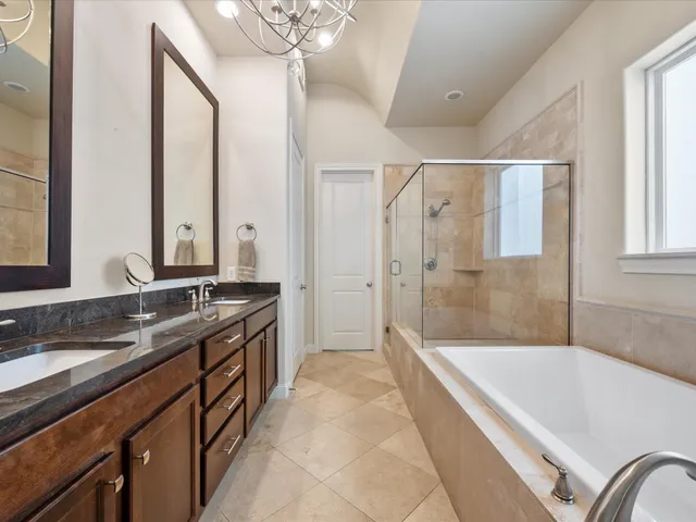a bath tub sitting next to a shower