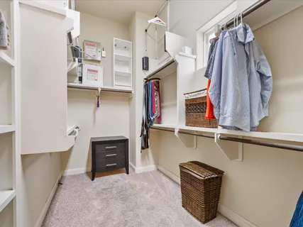 a view of a street with potted plants