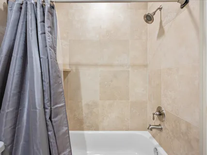 a view of a hallway with workspace and a window