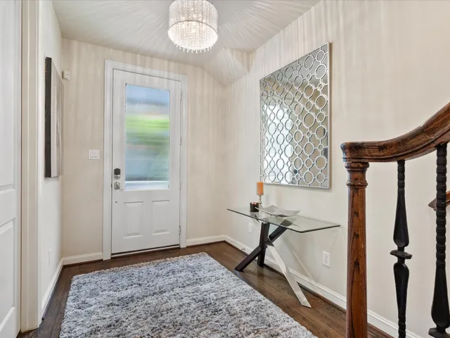 a kitchen with a table chairs stove and cabinets