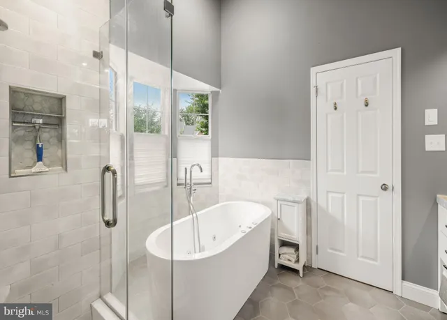 a bathroom with a tub and shower