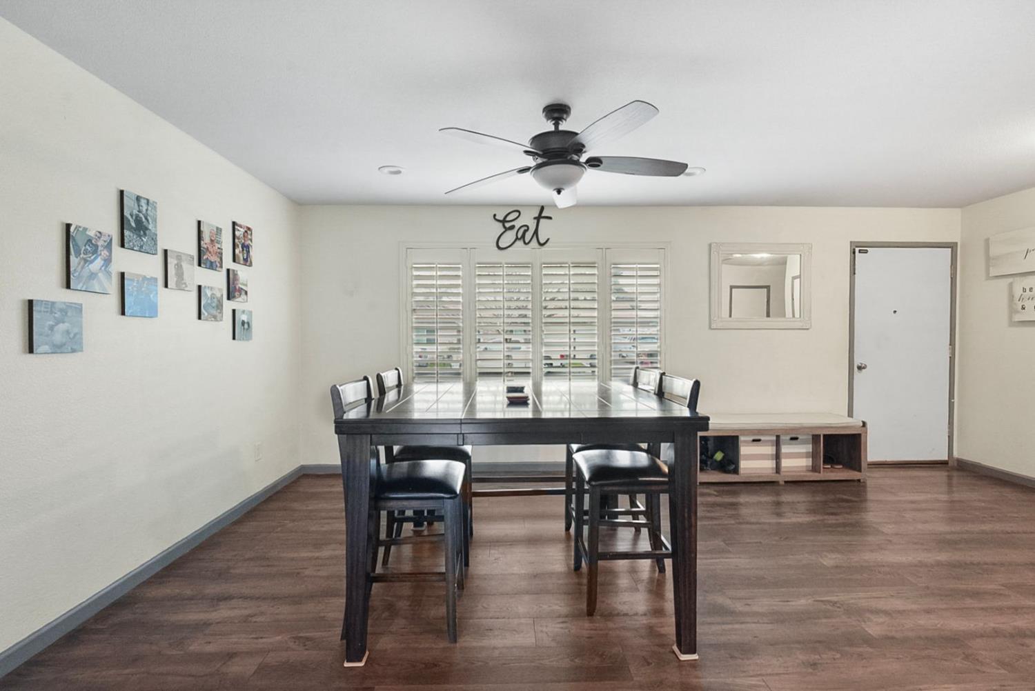 3360 Stanley Avenue Turlock, CA 95382 - Photo 5 of 17 a view of a a dining room with furniture window and wooden floor