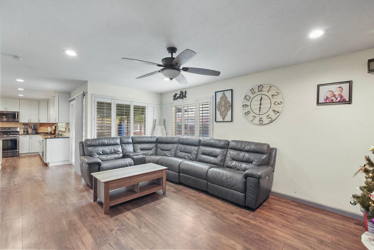 3360 Stanley Avenue Turlock, CA 95382 - Photo 9 of 17 a living room with furniture and wooden floor