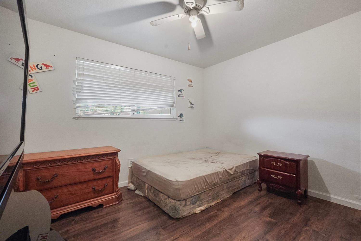 3360 Stanley Avenue Turlock, CA 95382 - Photo 10 of 17 a bedroom with a bed and a dresser
