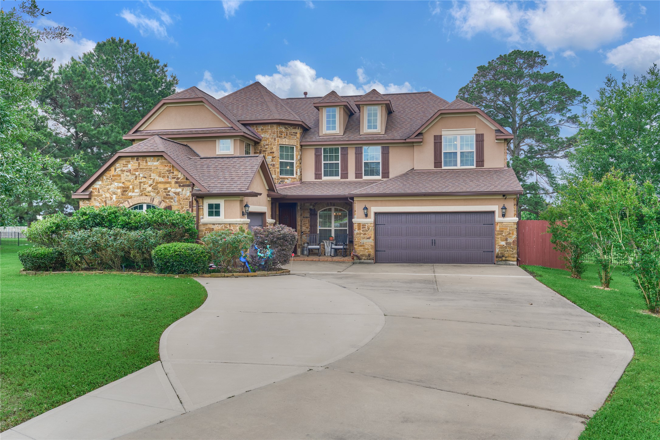 19089 Grandview Point Montgomery, TX 77356 - Photo 13 of 48 a front view of a house with a yard and garage