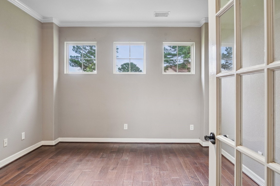 19089 Grandview Point Montgomery, TX 77356 - Photo 17 of 48 an empty room with wooden floor and window