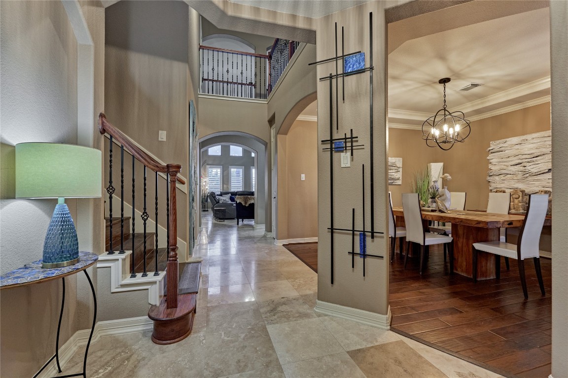 19089 Grandview Point Montgomery, TX 77356 - Photo 18 of 48 This inviting home features a stylish foyer with a staircase and a view into a living area. To the right, there's a spacious dining room with modern lighting and wooden flooring