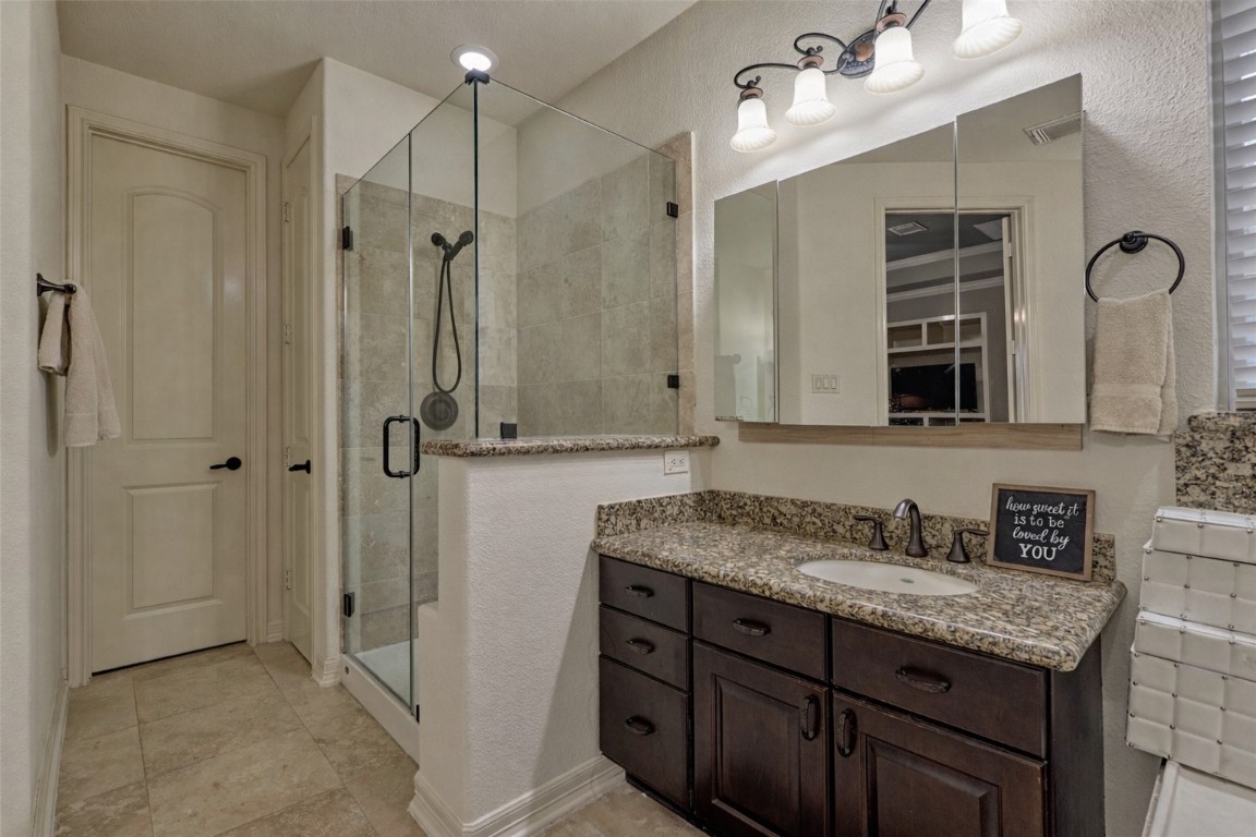19089 Grandview Point Montgomery, TX 77356 - Photo 30 of 48 a bathroom with a granite countertop sink mirror and double