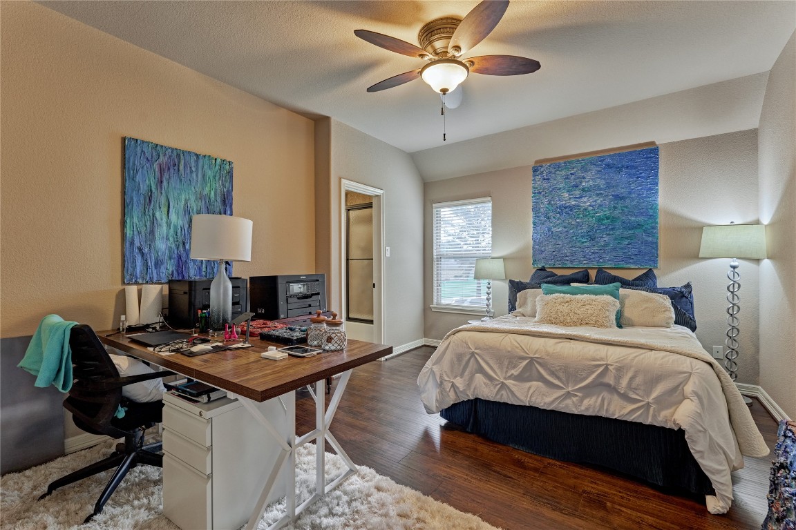 19089 Grandview Point Montgomery, TX 77356 - Photo 39 of 48 a bedroom with a bed and a chandelier