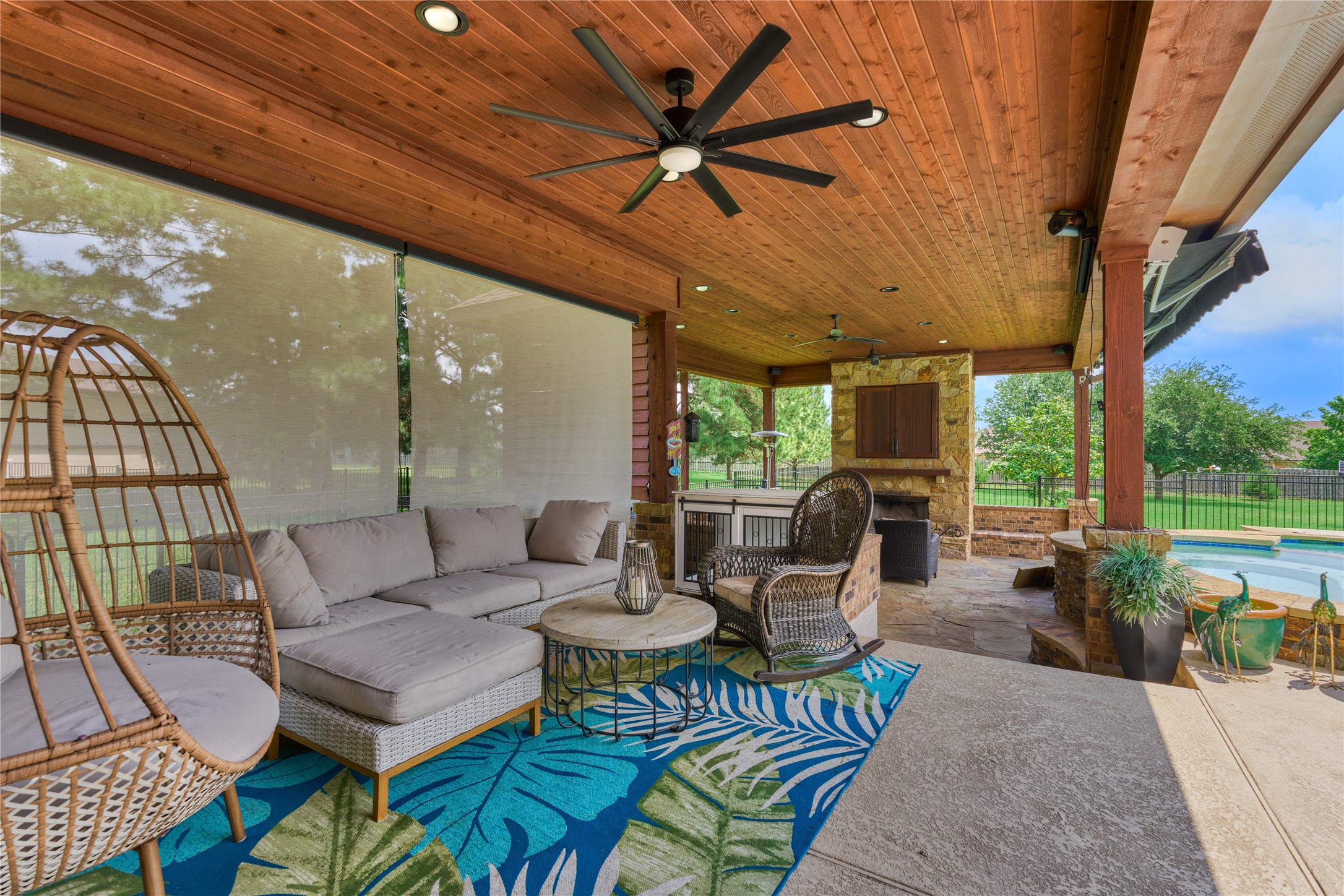 19089 Grandview Point Montgomery, TX 77356 - Photo 42 of 48 Inviting covered patio enhanced by a wooden ceilings and views of a lush backyard, perfect for relaxing or entertaining.