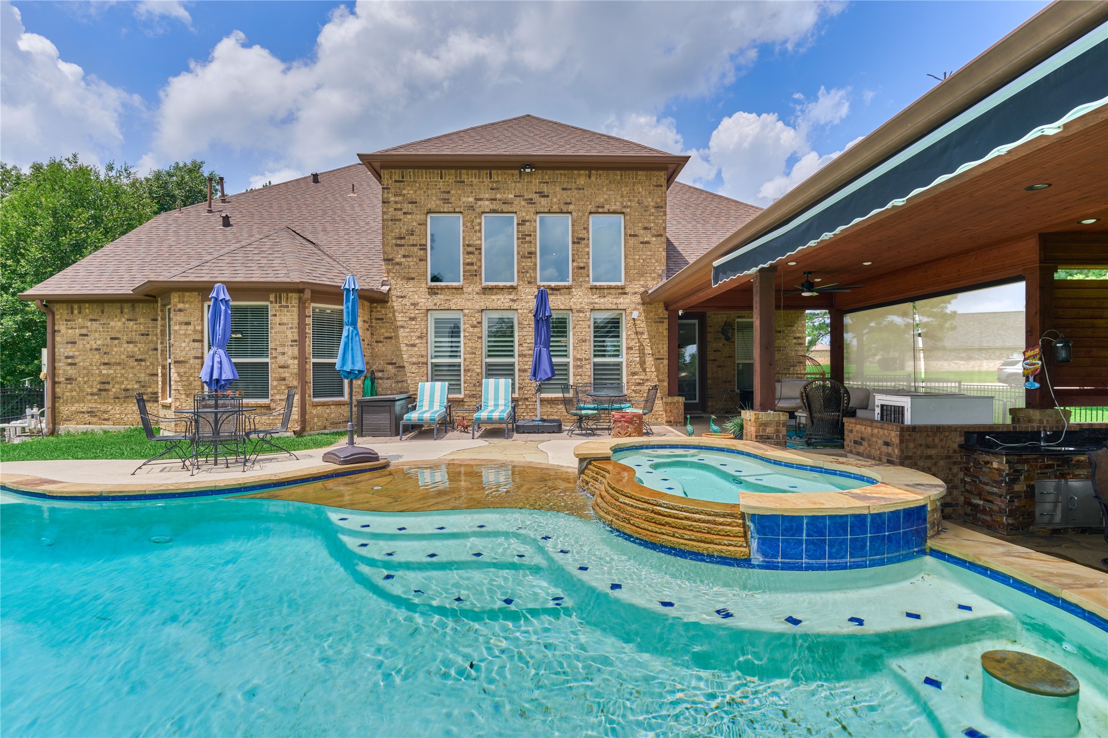 19089 Grandview Point Montgomery, TX 77356 - Photo 7 of 48 a front view of a house with swimming pool garden and patio