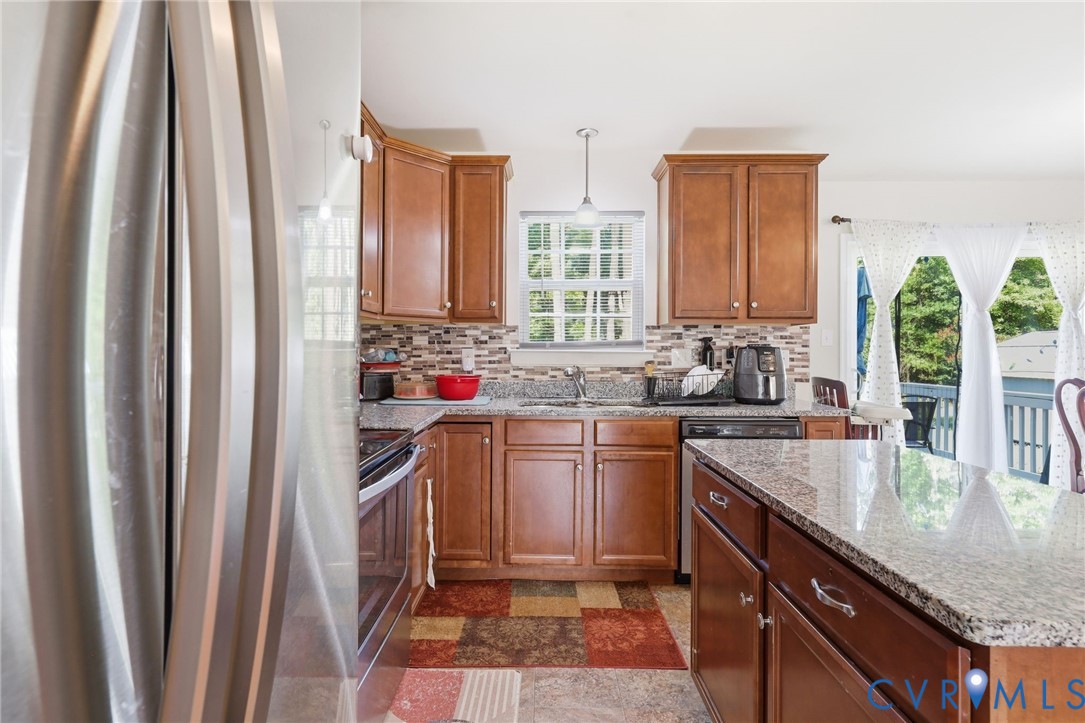10155 Virginia Road Glen Allen, VA 23060 - Photo 31 of 50 Kitchen featuring wood cabinetry, granite countert