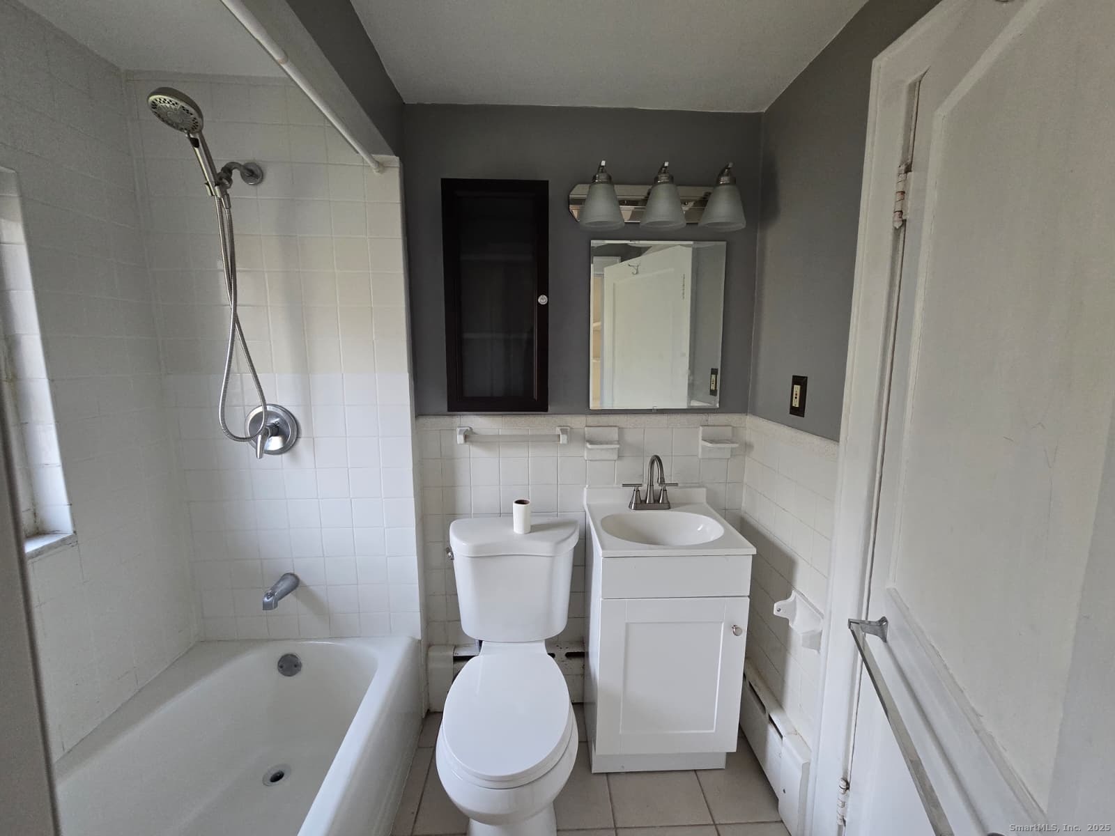 116 Hillside Avenue Middletown, CT 06457 - Photo 8 of 9 a bathroom with a toilet sink and mirror