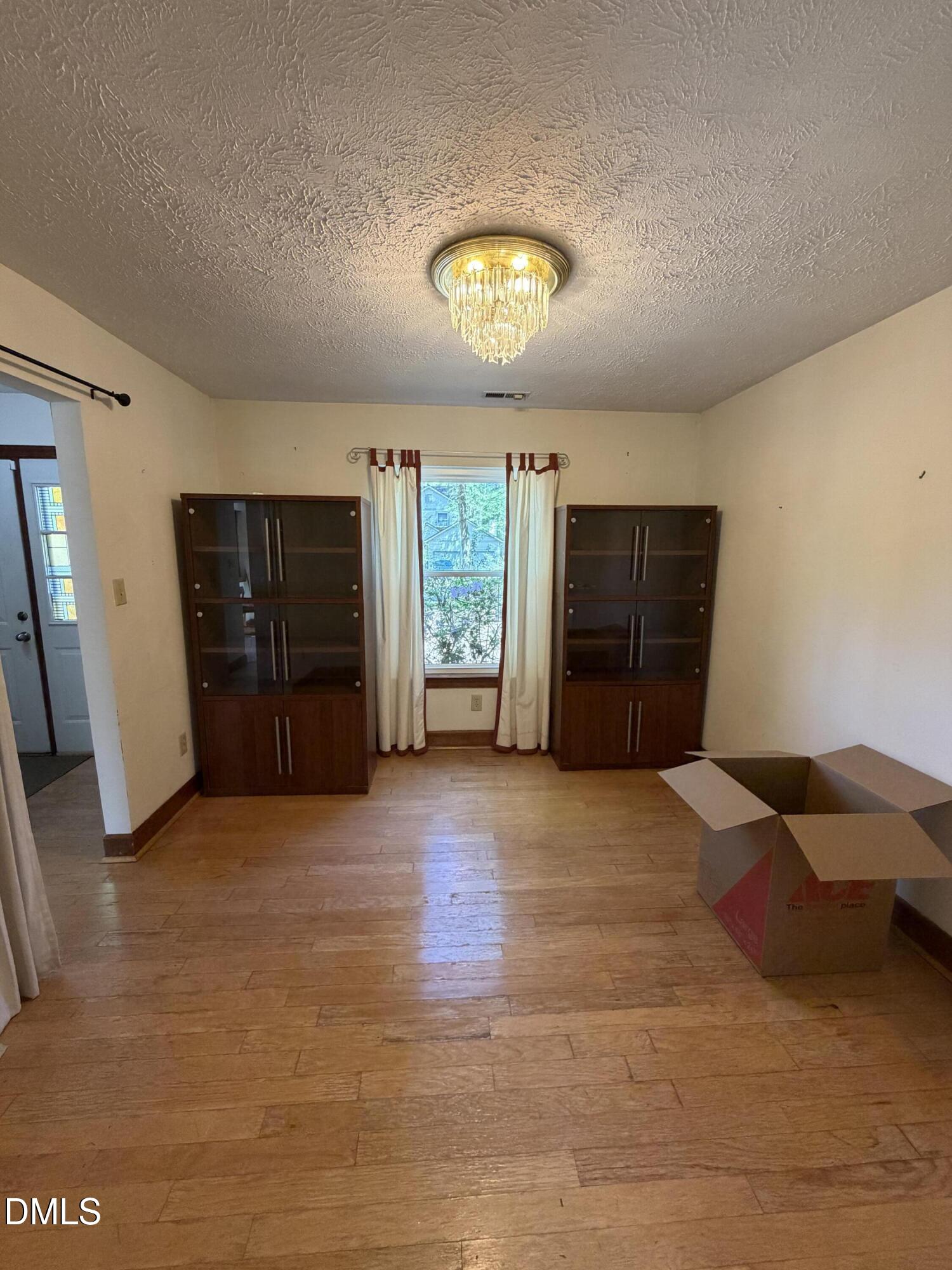 315 Hemming Way Durham, NC 27713 - Photo 13 of 21 a view of empty room with furniture and a window