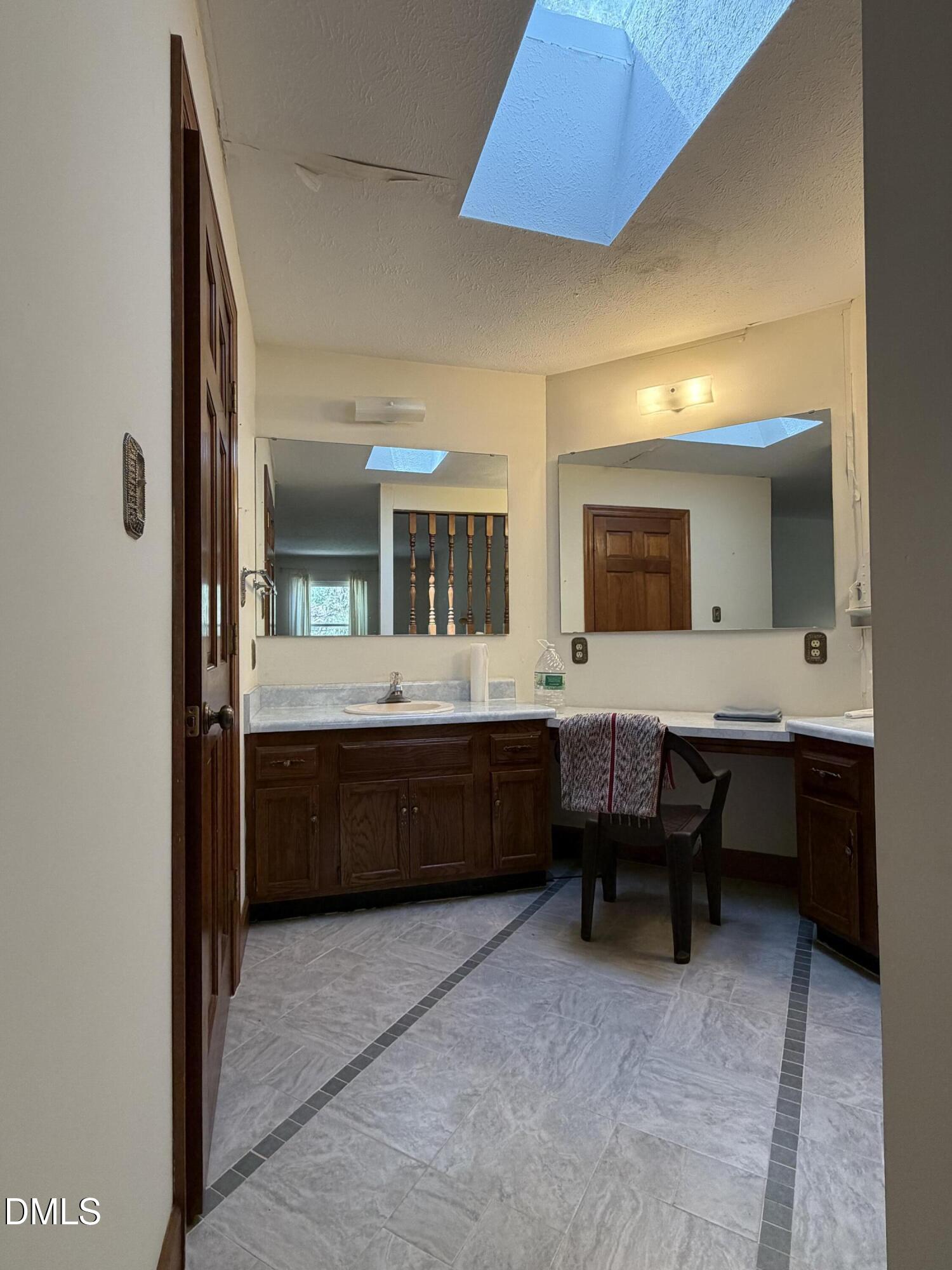 315 Hemming Way Durham, NC 27713 - Photo 17 of 21 a bathroom with a double vanity sink mirror and bathtub