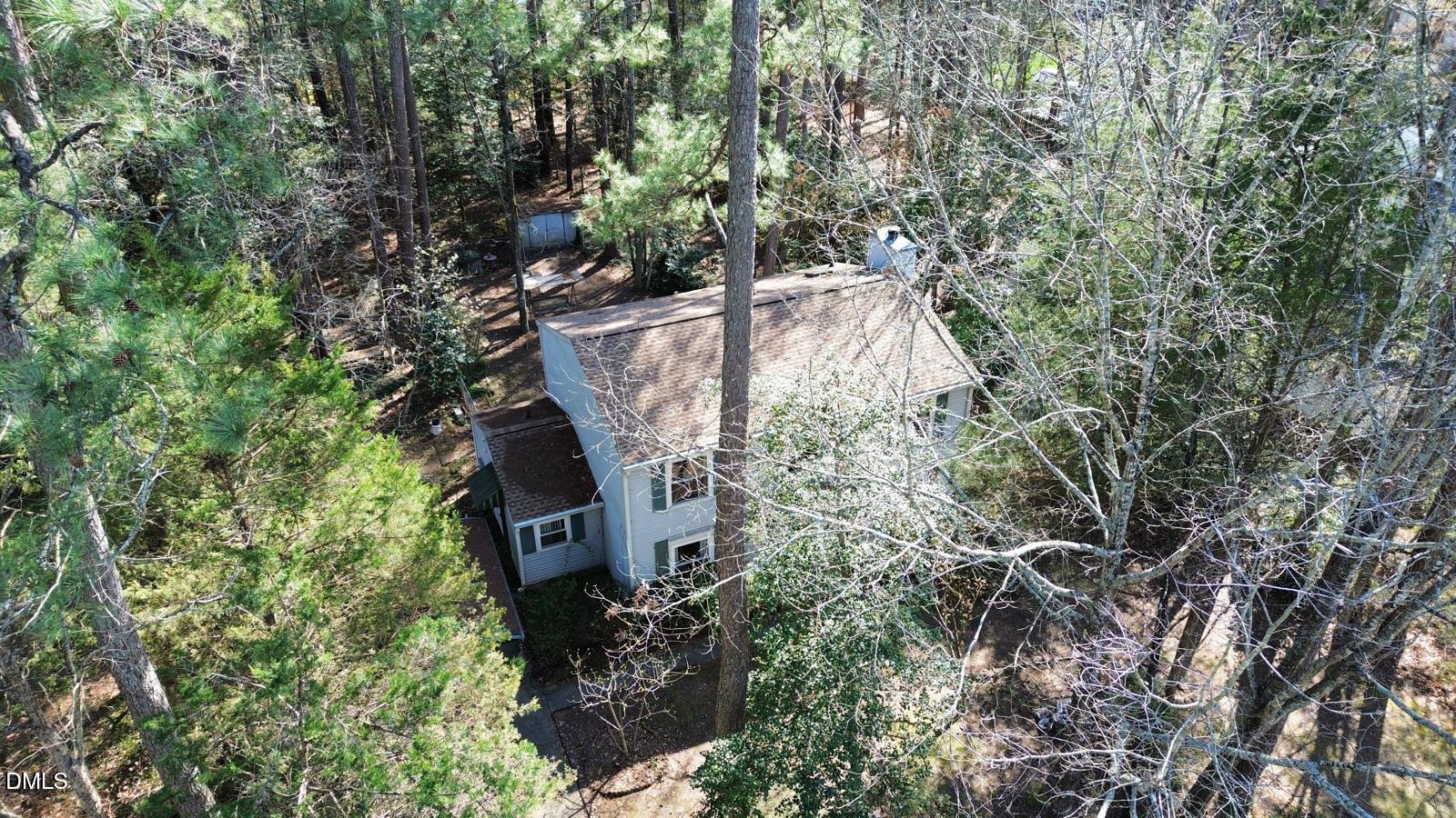 315 Hemming Way Durham, NC 27713 - Photo 4 of 21 a view of a house in a forest