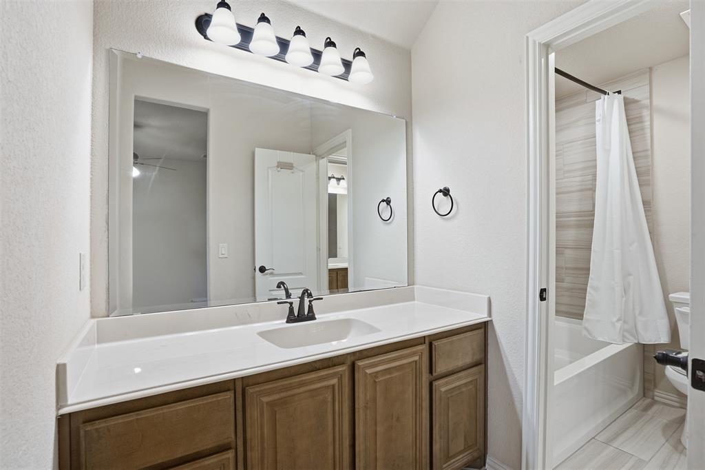 4002 Grove Valley Road Midlothian, TX 76065 - Photo 31 of 40 a bathroom with a sink and a mirror