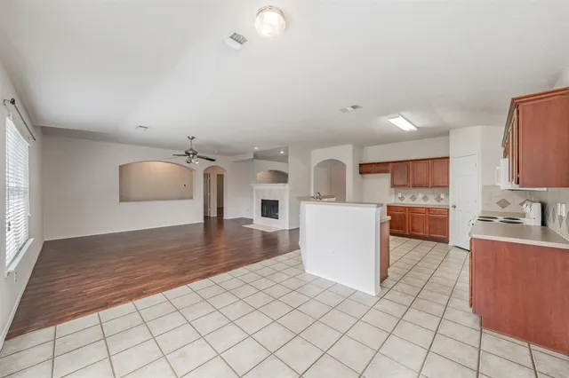 a kitchen with a sink cabinets and window