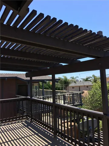 a view of balcony with wooden floor