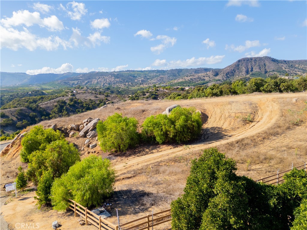 23476 La Vella Road Temecula, CA 92590 - Photo 18 of 29 a view of a lake with a mountain in the background