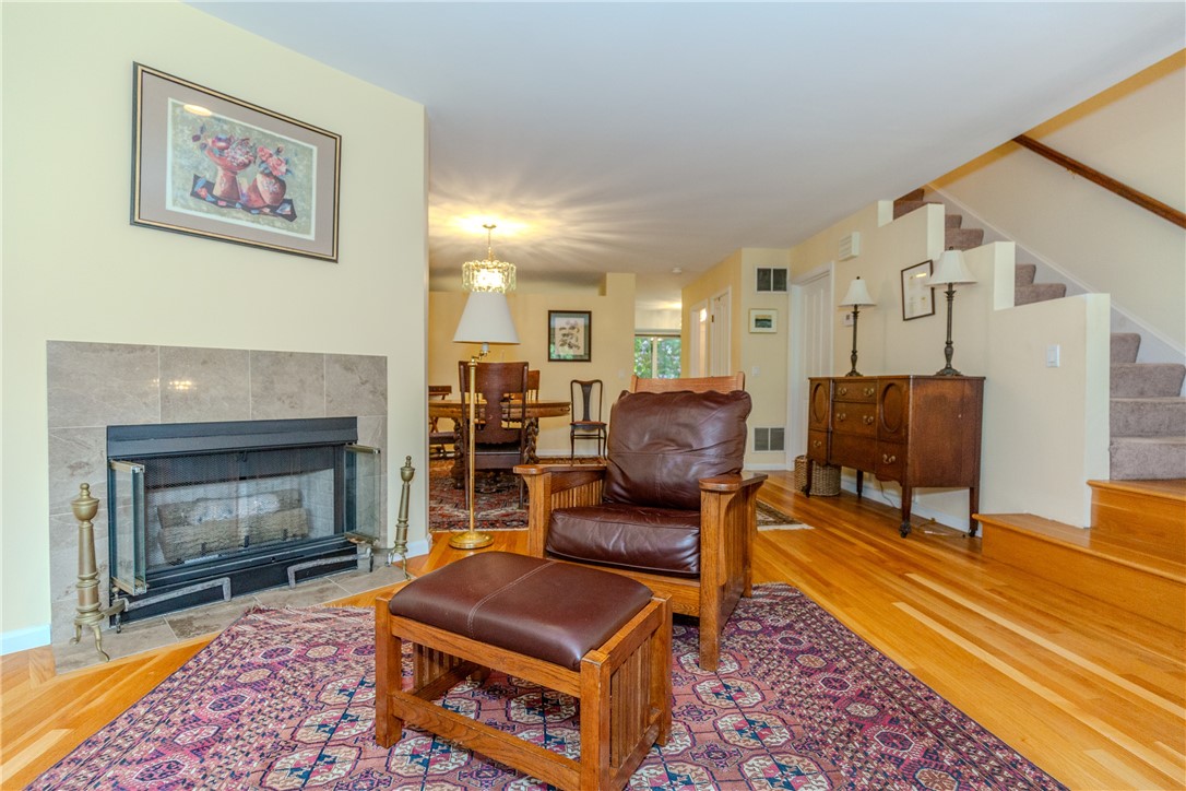 Living area offers marbled gas fireplace and is open to the dining area