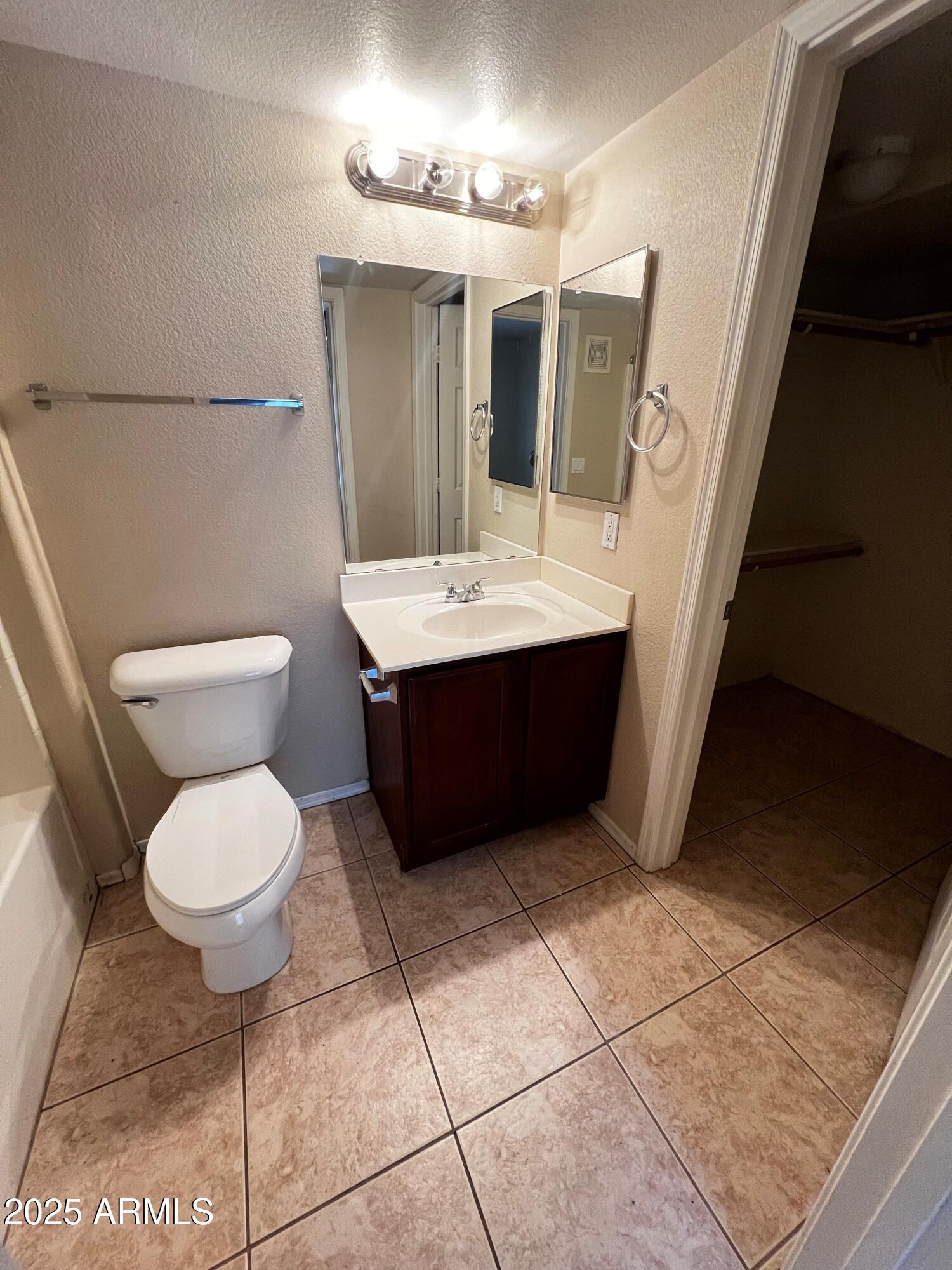 16825 North 14th Street, Unit 49 Phoenix, AZ 85022 - Photo 3 of 21 a bathroom with a sink a toilet and mirror