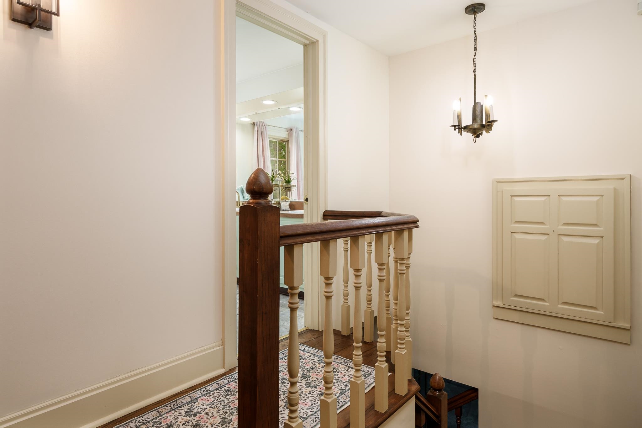 10562 Town Hall Road Belvidere, IL 61008 - Photo 40 of 72 a view of a hallway with wooden floor and stairs