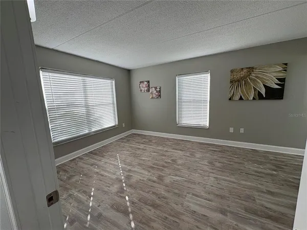 a view of an empty room with a window