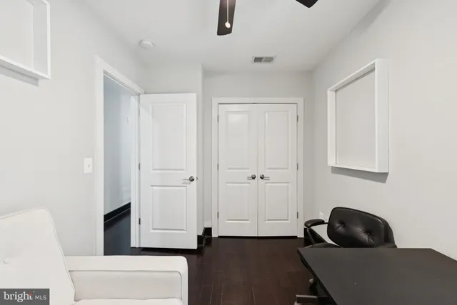 a bedroom with a bed and a chair